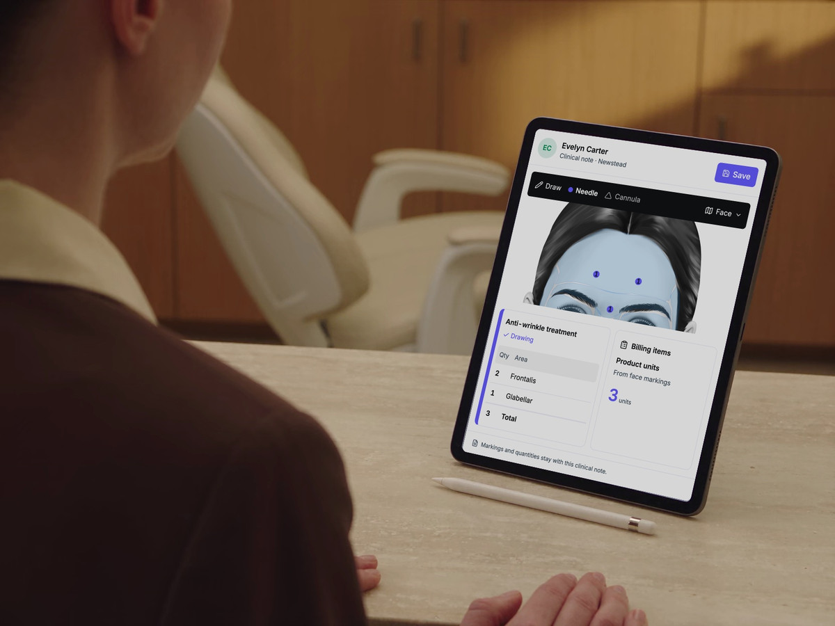 A practitioner reviews a DappleOS treatment note on a supported iPad in her clinic.