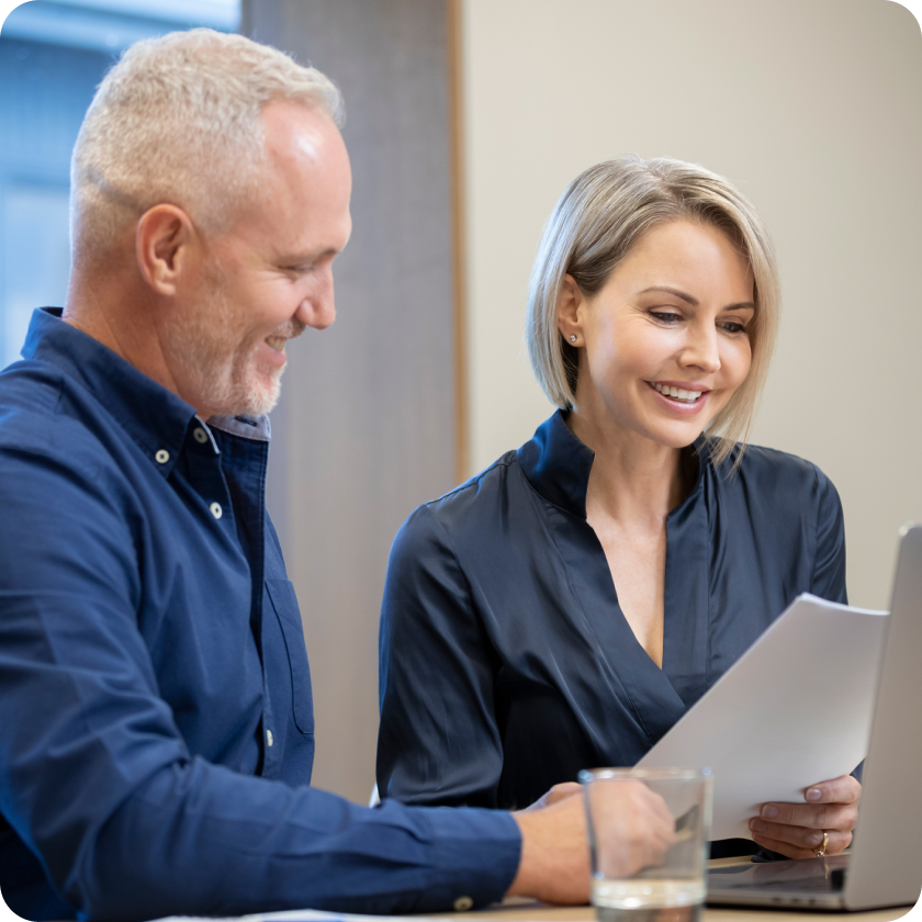Alex and Suzie Hoitink reviewing documents together.
