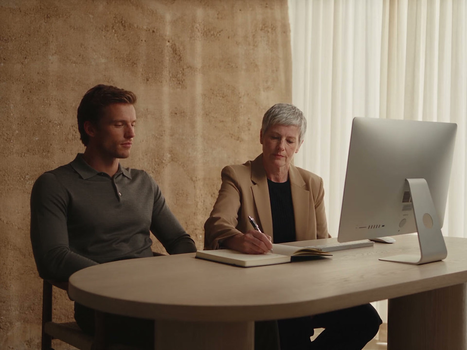 Two clinic colleagues review their follow-up work together