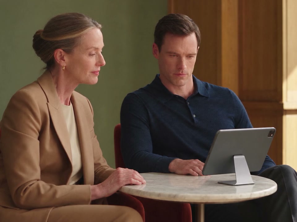 Two clinic colleagues reviewing information together on a supported iPad